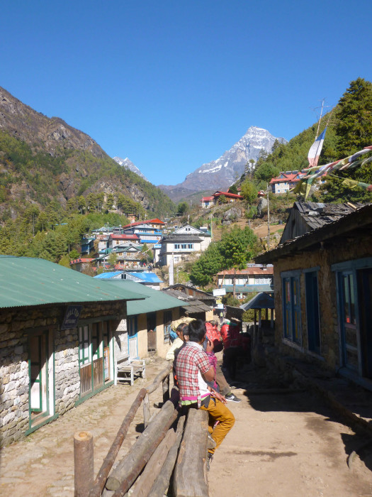 Walking through a village below Namche Bazaar