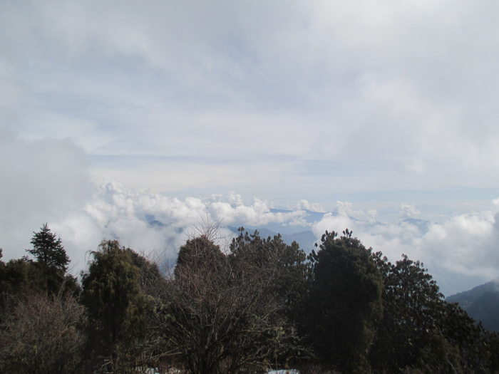 Looking down on the broiling clouds.