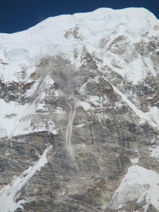 An avalanche coming down the south face of Dagpache (21,545 feet/6,567 meters). This peak is on the Tibet-Nepal border.