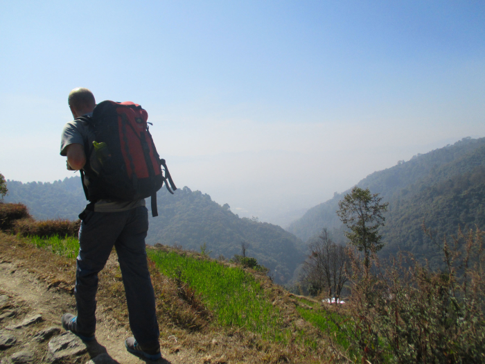 Mike hiking, with the Kathmandu Valley in the background.